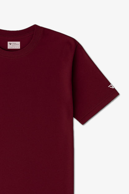 Close Up Flat Lay of a Maroon Deux Vincente T-shirt with logo on sleeve