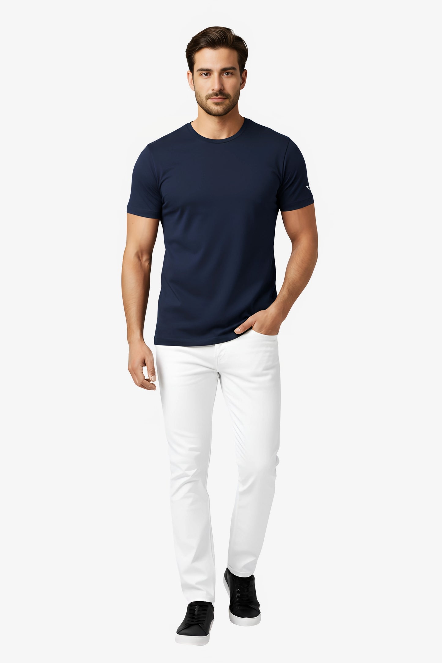 Man wearing a navy blue t-shirt with white deux vincente logo on sleeve and white pant