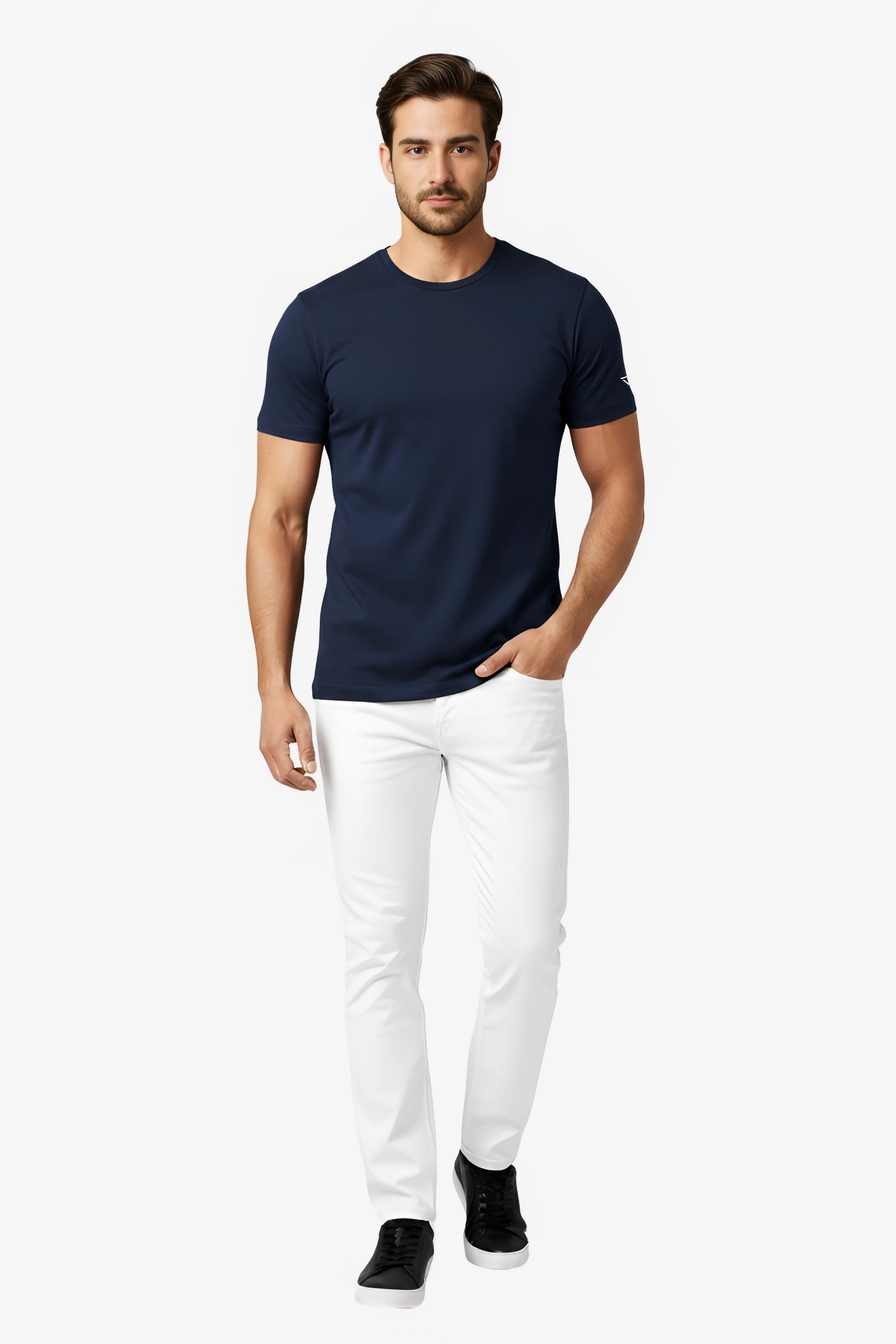 Man wearing a navy blue t-shirt with white deux vincente logo on sleeve and white pant