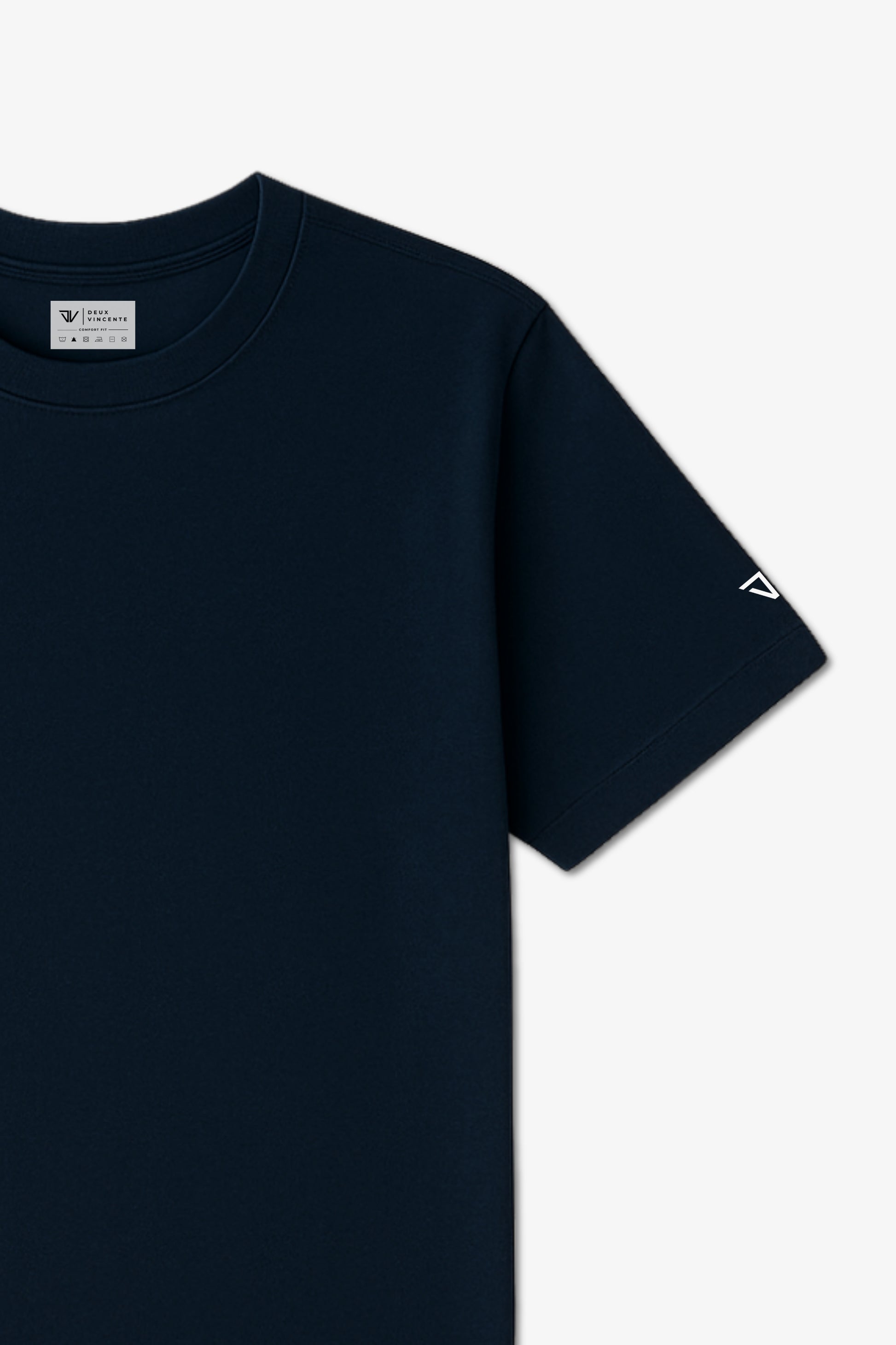 Close Up Flat Lay of a Navy Blue Deux Vincente T-shirt with logo on sleeve